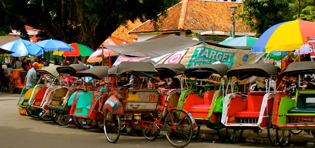 A line of becak waiting passengers in Yogyakarta