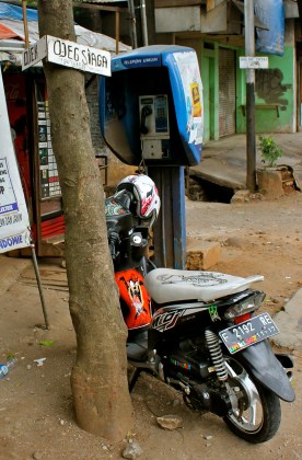 You can hitch a ride any where you see an "ojek" sign