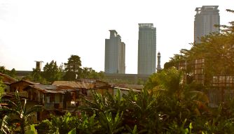 Jakarta slums against a back drop of high rise apartments