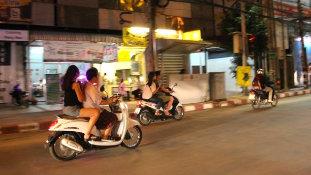 Thais look fabulous whizzing by on scooters in the Chiang Mai night. Tourists don't always fare as well. 
