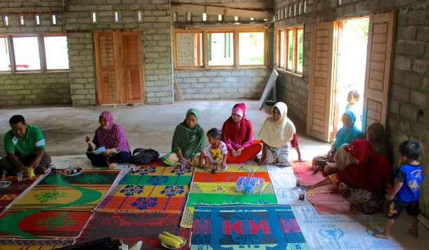 The women sat on the right side of the room with only coffee and water. My plate, full of corn is in the foreground.